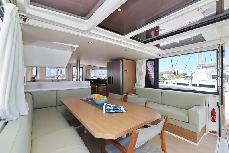 Breeze Yacht Photos Pics Luxurious interior of 2025 Bali 4.4 yacht with spacious seating and dining area.