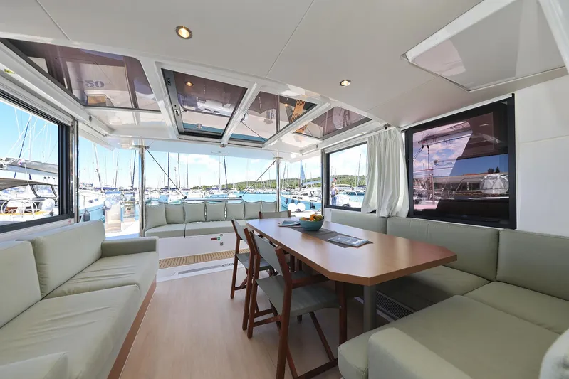 Breeze Yacht Photos Pics Luxurious interior of 2025 Bali 4.4 catamaran with spacious seating and dining area.