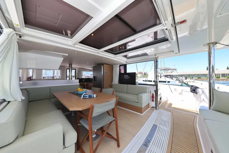 Breeze Yacht Photos Pics Luxurious interior of 2025 Bali 4.4 catamaran with spacious seating and dining area.