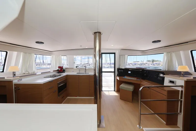 Breeze Yacht Photos Pics Luxurious interior of 2025 Bali 4.4 yacht with modern kitchen and navigation area.