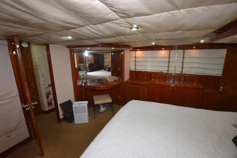 Big Hatt Yacht Photos Pics Luxurious interior of 1998 Hatteras 74 Sport Deck yacht with elegant wood finishes.