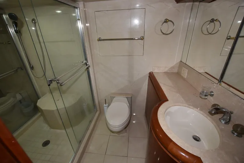 Big Hatt Yacht Photos Pics Bathroom interior of 1998 Hatteras 74 Sport Deck yacht with shower and sink.