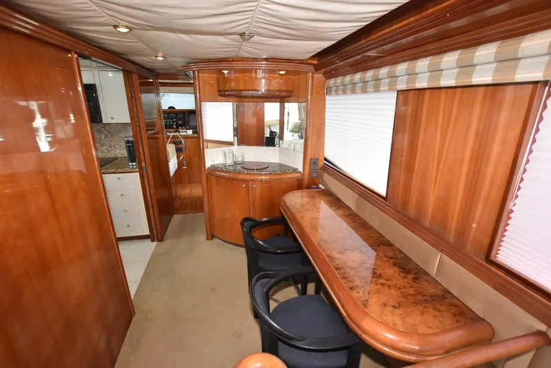 Big Hatt Yacht Photos Pics Luxurious interior of 1998 Hatteras 74 Sport Deck yacht with elegant wood finishes.