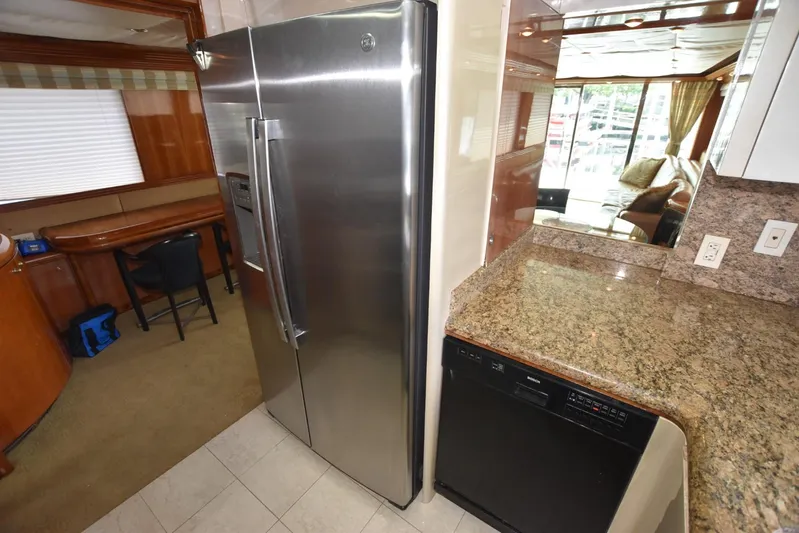 Big Hatt Yacht Photos Pics Luxurious kitchen interior of 1998 Hatteras 74 Sport Deck yacht with granite countertops.