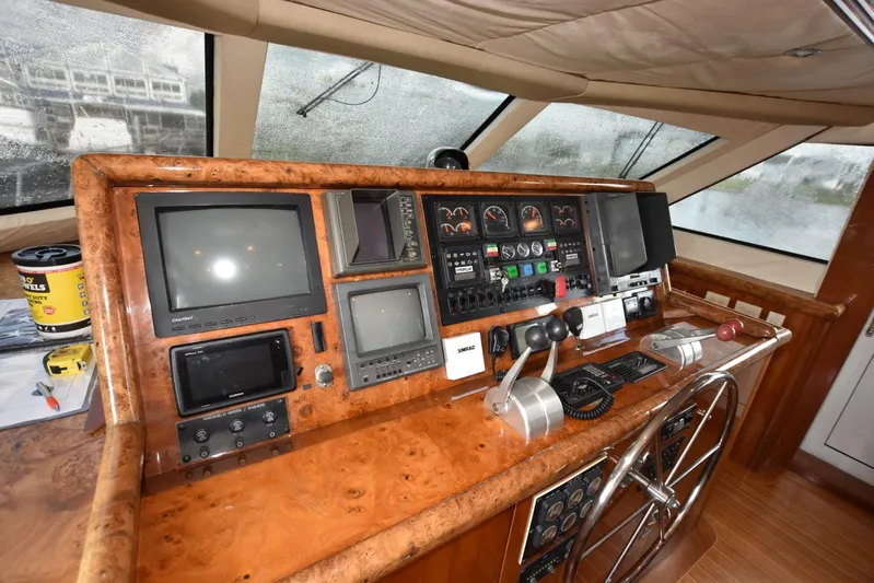 Big Hatt Yacht Photos Pics Cockpit of 1998 Hatteras 74 Sport Deck yacht with navigation instruments and controls.