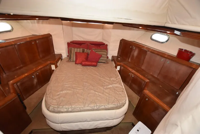 Big Hatt Yacht Photos Pics Luxurious cabin interior of 1998 Hatteras 74 Sport Deck yacht with wood cabinetry.