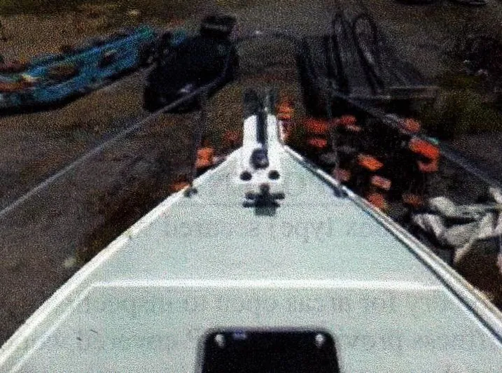 Janet Lynn Yacht Photos Pics Bow view of a 1999 Custom 30 Novi Hardtop Cruiser on land.