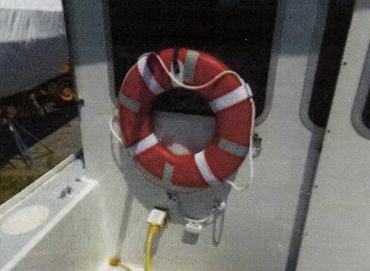 Janet Lynn Yacht Photos Pics Red life ring on 1999 Custom 30 Novi Hardtop Cruiser deck.