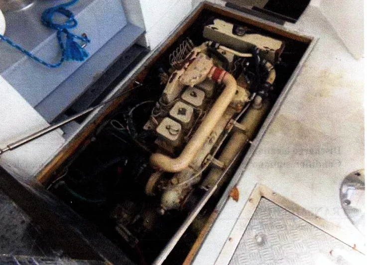 Janet Lynn Yacht Photos Pics Engine compartment of a 1999 Custom 30 Novi Hardtop Cruiser, showcasing mechanical components.