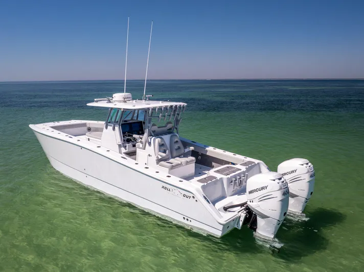  Yacht Photos Pics 2022 Freeman 34VH boat with twin Mercury engines on clear green water.