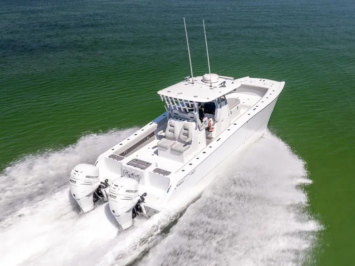  Yacht Photos Pics 2022 Freeman 34VH boat cruising on open water, featuring dual Mercury engines.