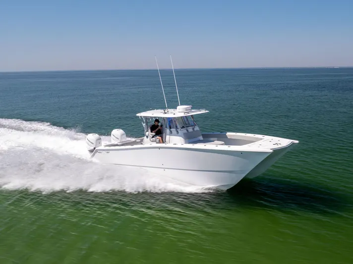  Yacht Photos Pics 2022 Freeman 34VH boat cruising on open water, showcasing sleek design and performance.