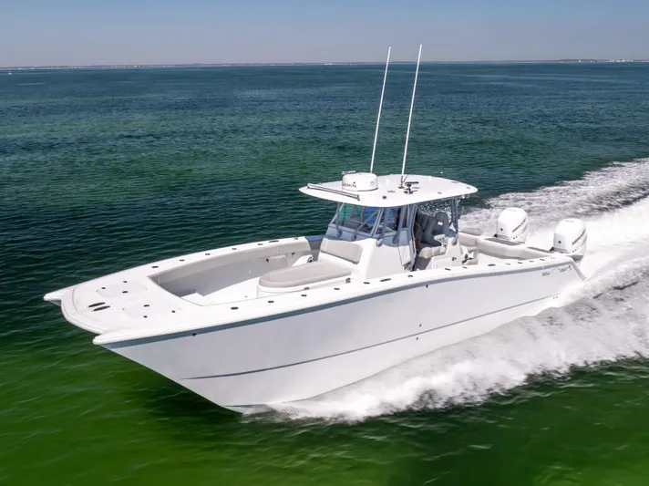  Yacht Photos Pics 2022 Freeman 34VH boat cruising on open water, showcasing sleek design and powerful performance.