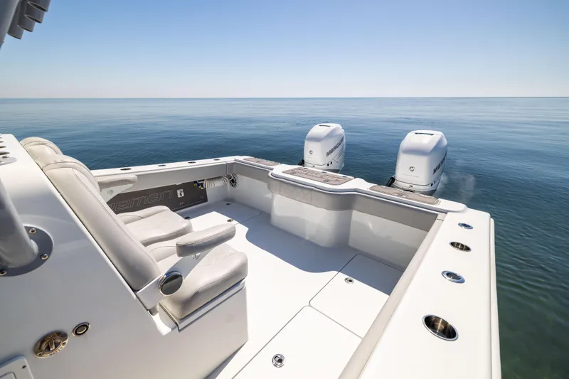  Yacht Photos Pics 2022 Freeman 34VH boat with dual engines on calm ocean waters.