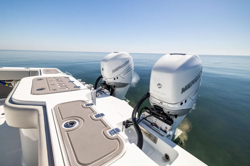  Yacht Photos Pics 2022 Freeman 34VH boat with dual Mercury outboard engines on calm sea.