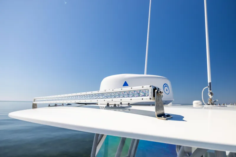  Yacht Photos Pics 2022 Freeman 34VH boat radar and antenna against clear blue sky.