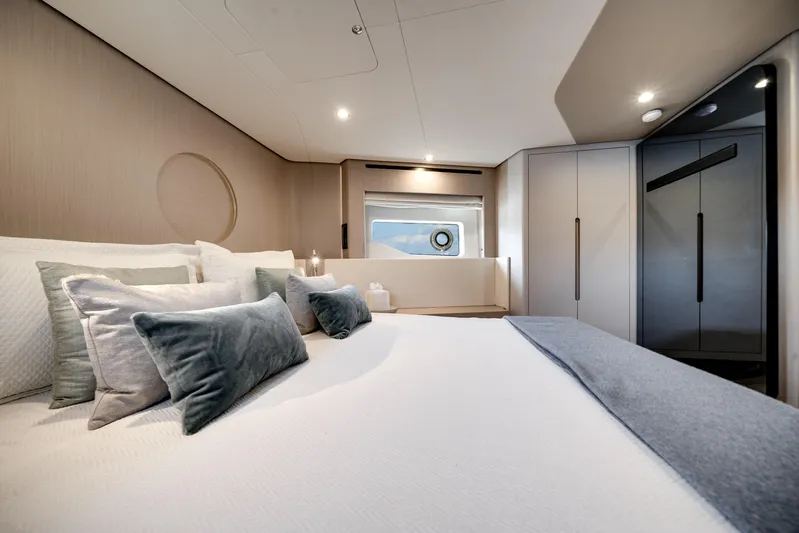 Spysea Yacht Photos Pics Luxurious bedroom interior of 2023 Azimut Fly 68 yacht with elegant decor and soft lighting.