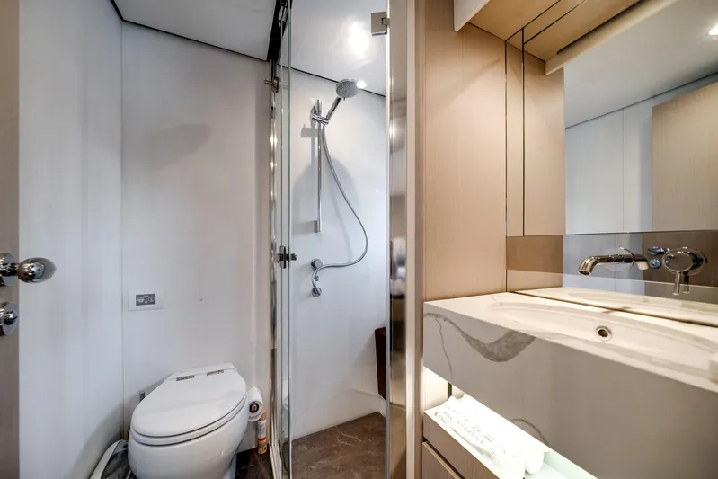 Spysea Yacht Photos Pics Luxurious bathroom in 2023 Azimut Fly 68 yacht with modern fixtures and elegant design.