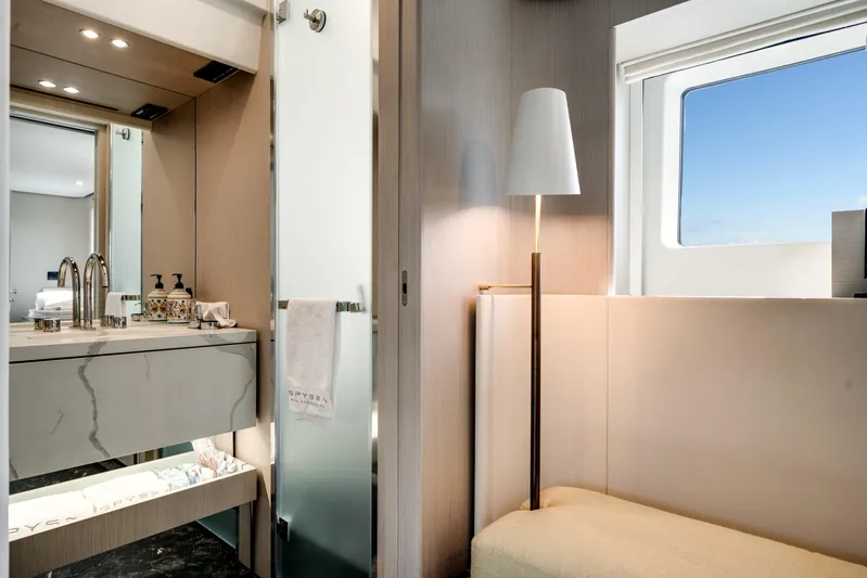 Spysea Yacht Photos Pics Luxurious interior of 2023 Azimut Fly 68 yacht bathroom with modern fixtures and window view.