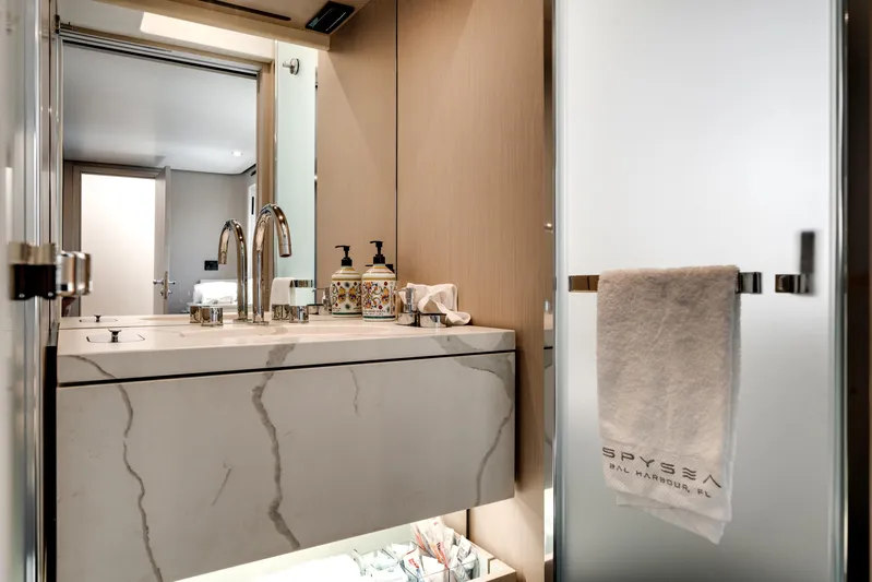 Spysea Yacht Photos Pics Luxurious bathroom in 2023 Azimut Fly 68 yacht with marble sink and elegant fixtures.