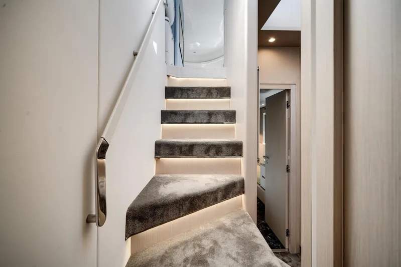 Spysea Yacht Photos Pics Luxurious interior staircase of 2023 Azimut Fly 68 yacht with modern lighting.