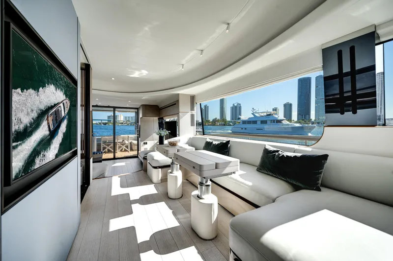 Spysea Yacht Photos Pics Luxurious interior of 2023 Azimut Fly 68 yacht with city skyline view.