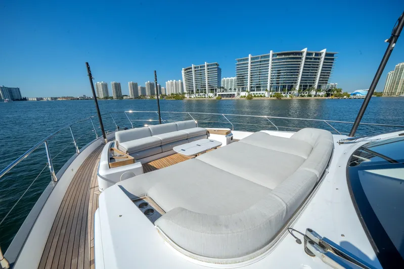 Spysea Yacht Photos Pics Luxurious 2023 Azimut Fly 68 yacht with spacious deck, city skyline in background.