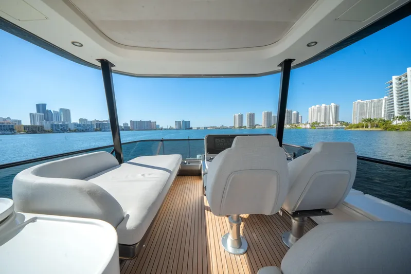 Spysea Yacht Photos Pics Luxurious 2023 Azimut Fly 68 yacht interior with waterfront cityscape view.