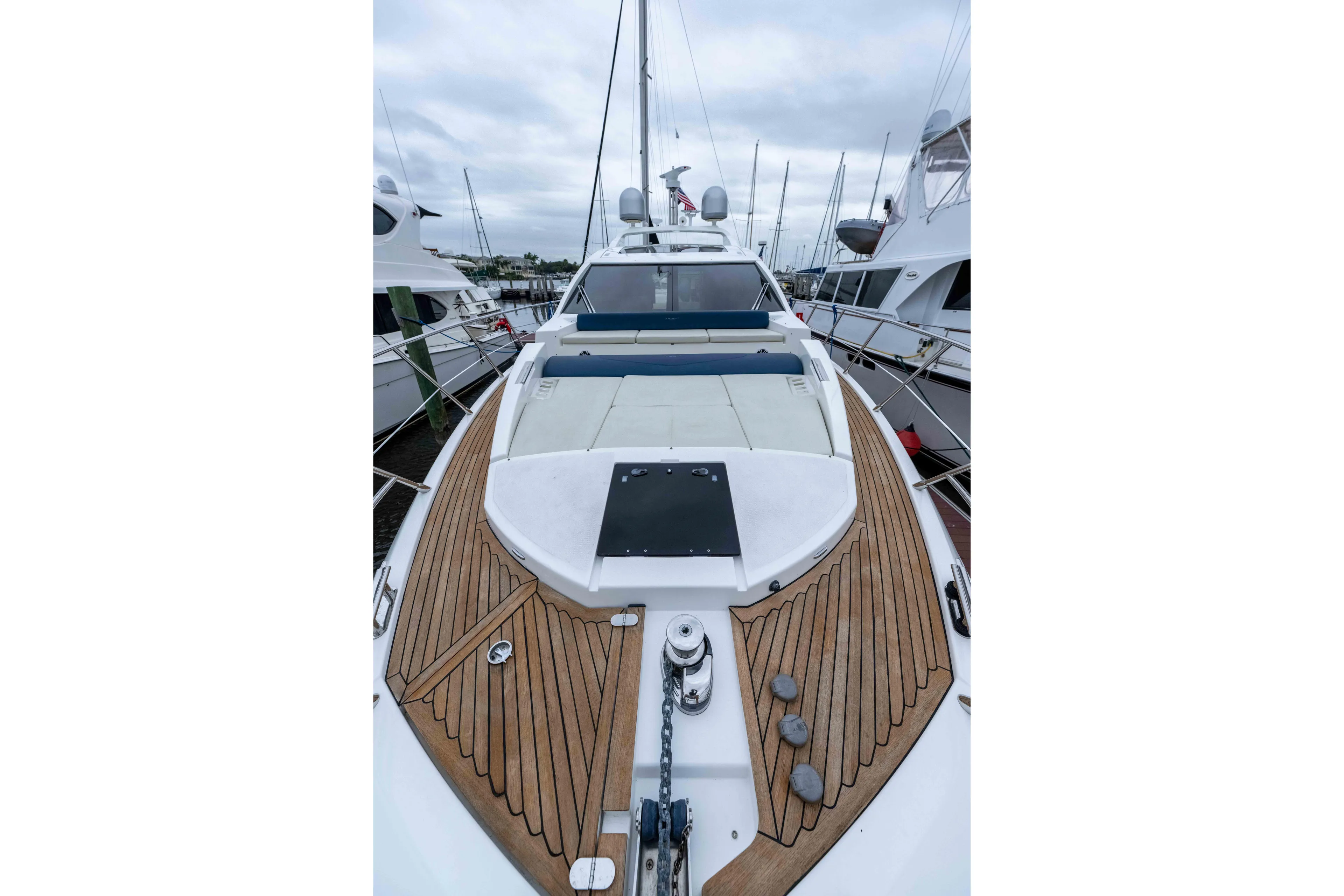 Treasure X Yacht Photos Pics 2015 Azimut 55S yacht with sleek deck design, docked in a marina.