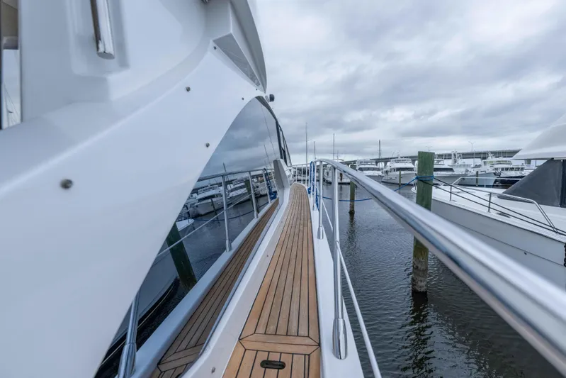 Treasure X Yacht Photos Pics 2015 Azimut 55S yacht docked, showcasing sleek design and wooden deck.