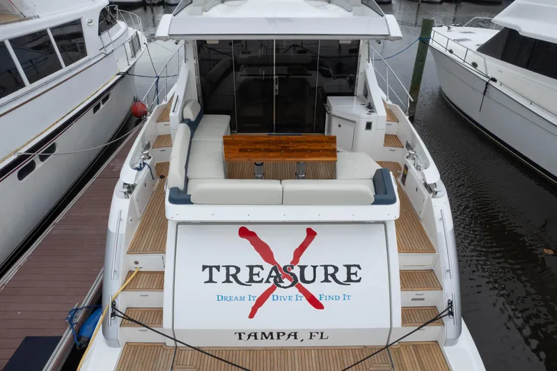 Treasure X Yacht Photos Pics 2015 Azimut 55S yacht docked, featuring "Treasure" branding and Tampa, FL location.