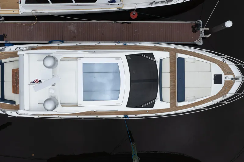 Treasure X Yacht Photos Pics Overhead view of a 2015 Azimut 55S yacht docked at a marina.