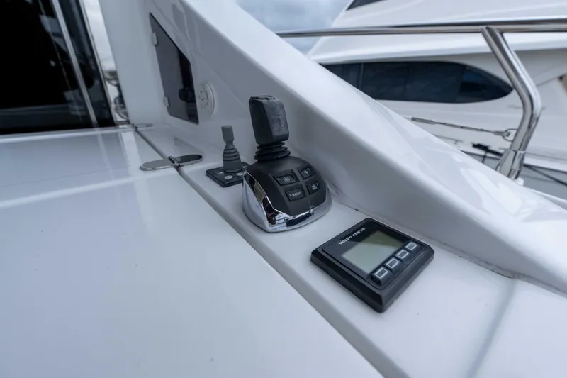 Treasure X Yacht Photos Pics Control panel on 2015 Azimut 55S yacht, featuring joystick and digital display.