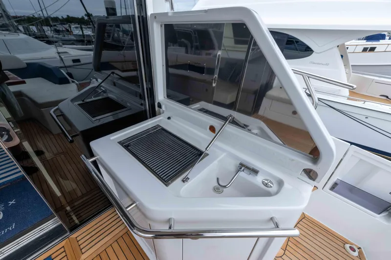 Treasure X Yacht Photos Pics Outdoor kitchen on 2015 Azimut 55S yacht with grill and sink.