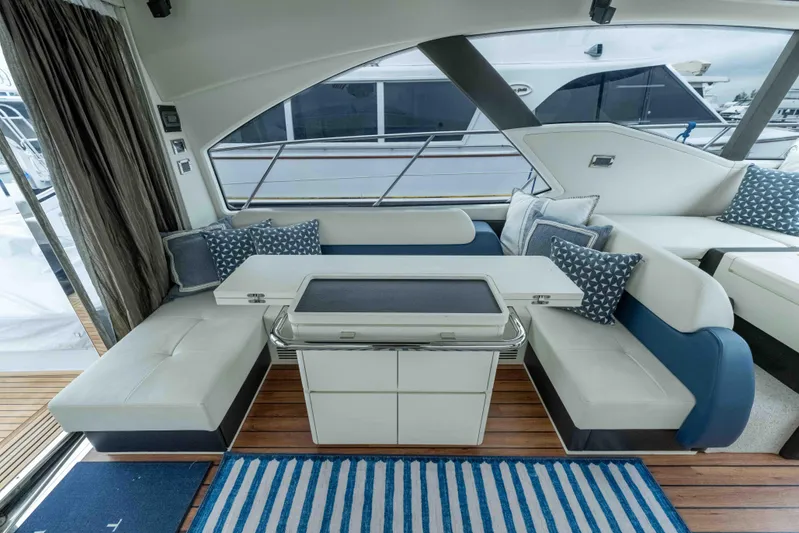 Treasure X Yacht Photos Pics Luxurious interior of 2015 Azimut 55S yacht with elegant seating and modern decor.