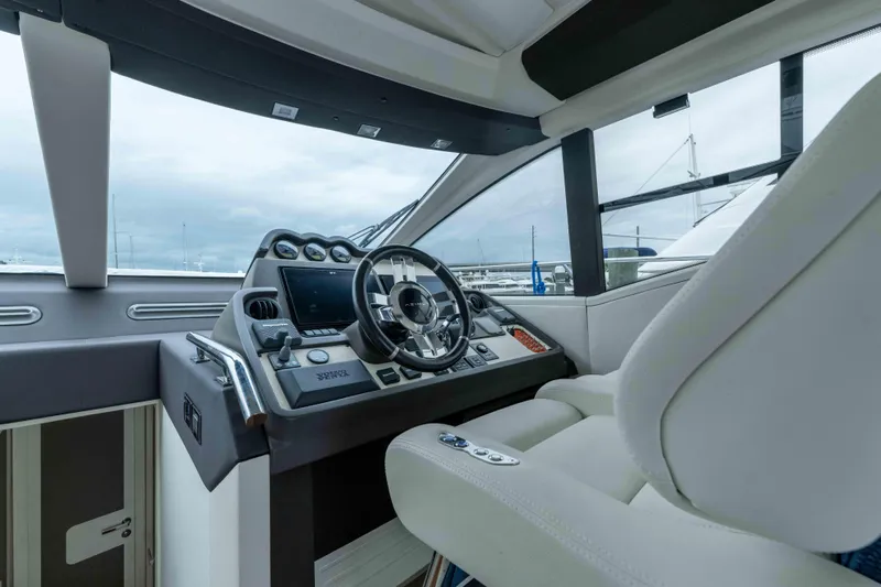 Treasure X Yacht Photos Pics Cockpit of 2015 Azimut 55S yacht with modern steering and controls.