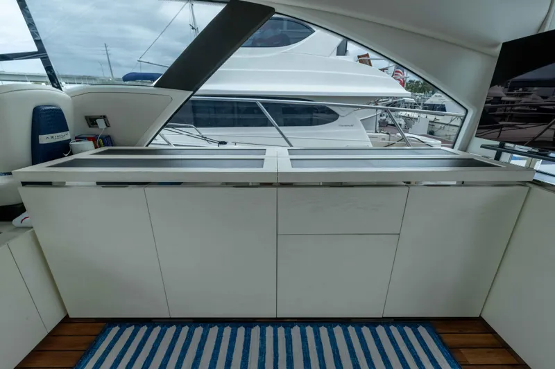Treasure X Yacht Photos Pics Interior of 2015 Azimut 55S yacht with sleek cabinetry and modern design.
