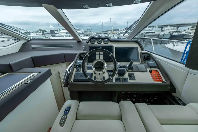 Treasure X Yacht Photos Pics Cockpit of 2015 Azimut 55S yacht with modern navigation controls and steering wheel.
