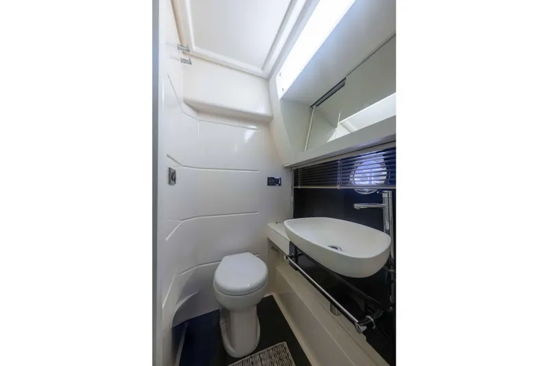 Treasure X Yacht Photos Pics Luxurious bathroom in 2015 Azimut 55S yacht with modern fixtures and sleek design.