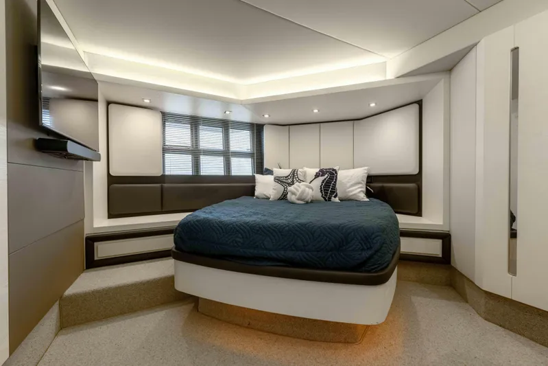 Treasure X Yacht Photos Pics Luxurious bedroom interior of 2015 Azimut 55S yacht with modern design and cozy bedding.