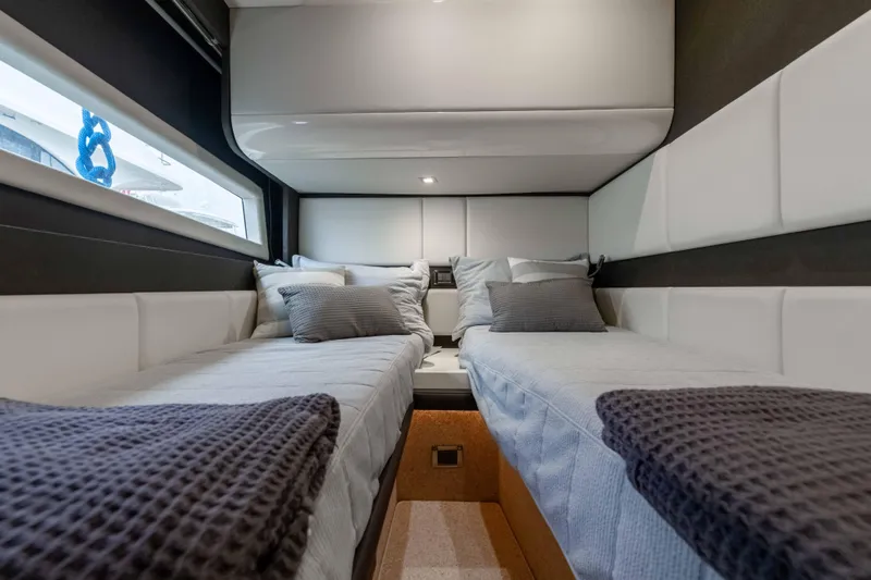 Treasure X Yacht Photos Pics Luxurious twin cabin interior of 2015 Azimut 55S yacht with modern design and cozy bedding.