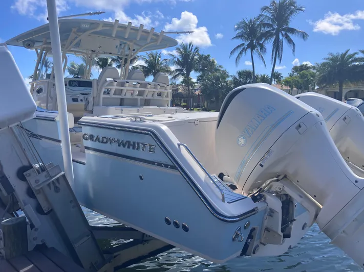  Yacht Photos Pics 2018 Grady-White Canyon 336 boat docked, featuring Yamaha outboard engines, under a sunny sky.
