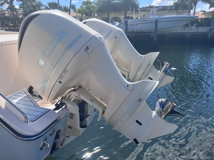  Yacht Photos Pics Twin Yamaha outboard engines on a 2018 Grady-White Canyon 336 boat docked by the water.