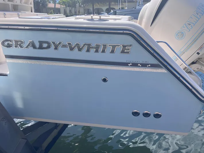  Yacht Photos Pics 2018 Grady-White Canyon 336 boat, side view with logo and Yamaha engine.