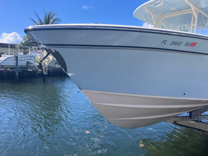  Yacht Photos Pics 2018 Grady-White Canyon 336 boat docked by the water, sunny day.
