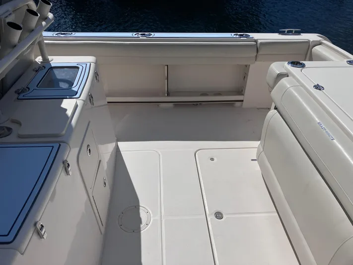  Yacht Photos Pics 2018 Grady-White Canyon 336 boat deck, featuring storage compartments and seating.