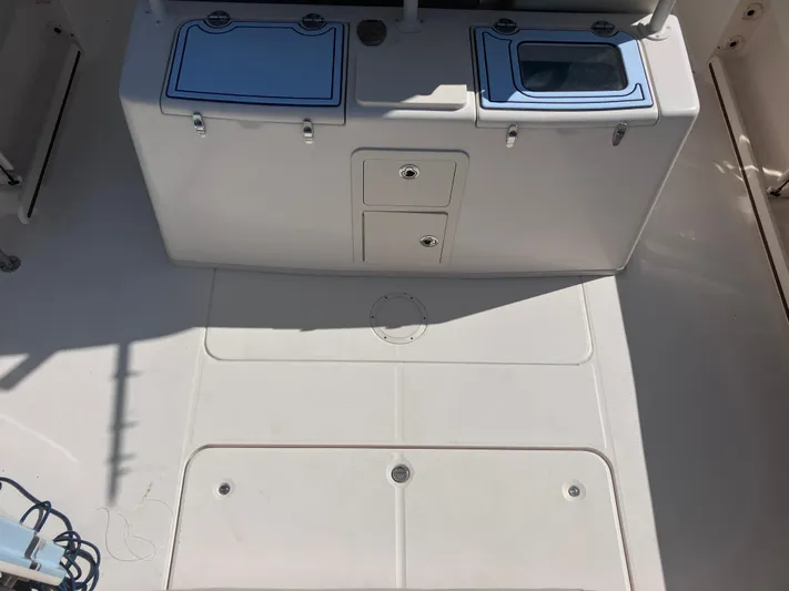  Yacht Photos Pics 2018 Grady-White Canyon 336 boat deck with storage compartments and clean surface.