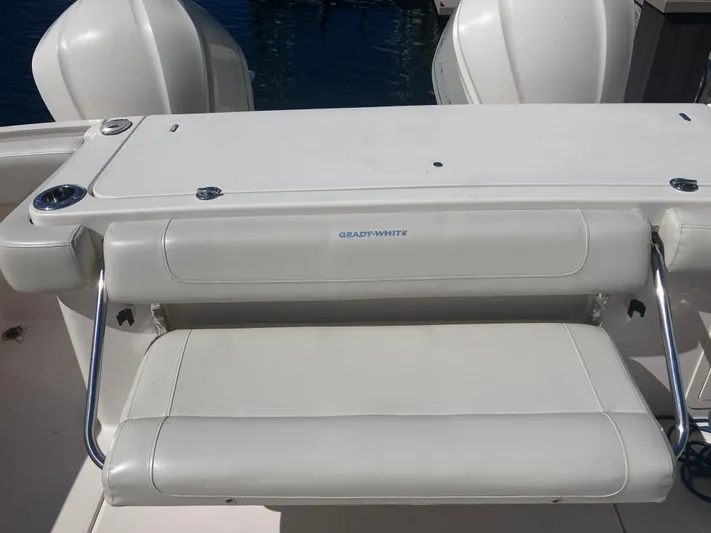  Yacht Photos Pics 2018 Grady-White Canyon 336 boat seat with white upholstery and stainless steel supports.