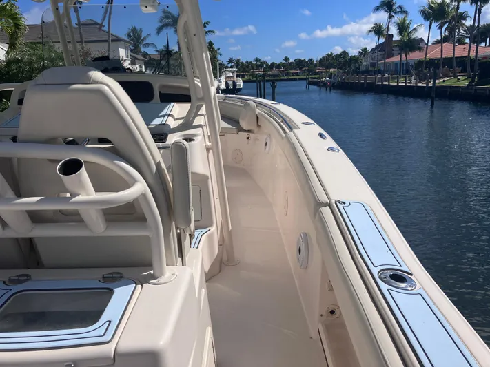  Yacht Photos Pics 2018 Grady-White Canyon 336 boat docked on a sunny canal.