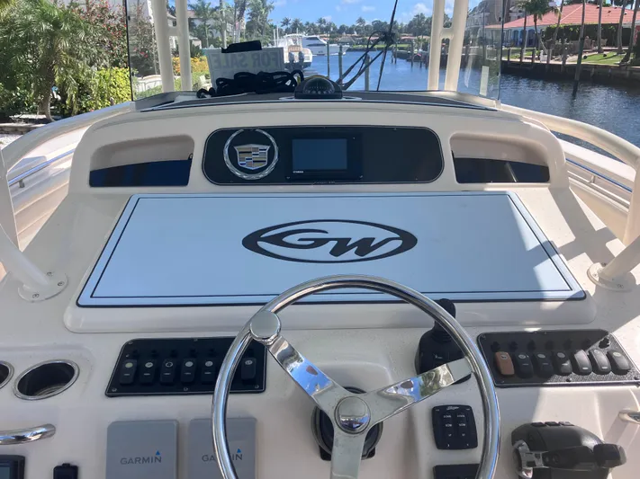  Yacht Photos Pics 2018 Grady-White Canyon 336 helm with steering wheel and control panel.